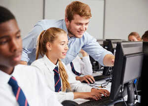 children using a laptop in a classroom children using a laptop in a classroom