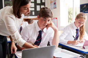 students using laptop in school