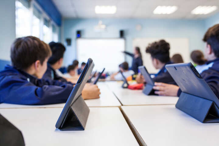 Children in a classroom using tablets