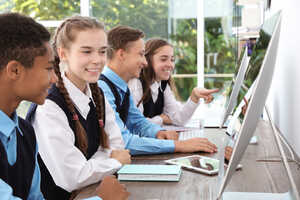students using desktop computers in school students using desktop computers in school