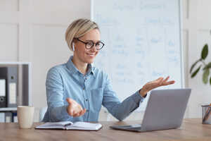 Teacher using a laptop to train