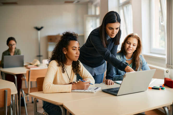 girl using a laptop in the classroom