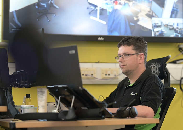 teacher helping students with IT work teacher helping students with IT work